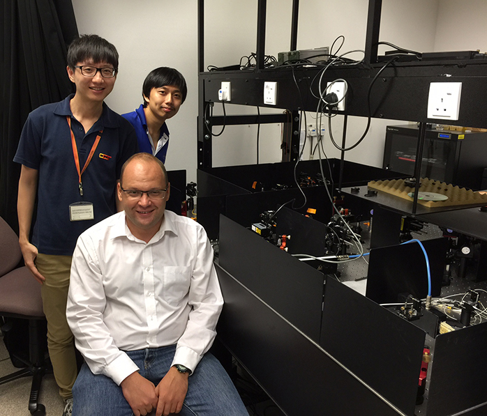 Researchers from the Centre for Quantum Technologies and Data Storage Institute with their experiment.