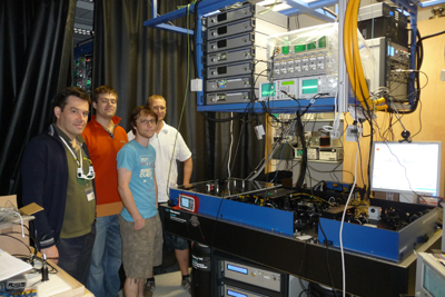 Photograph of CQT researchers with the optical frequency comb installed in 2011.