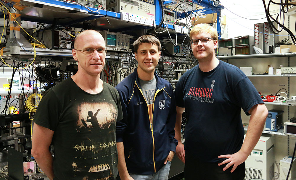 Murray Barrett, Kyle Arnold and Markus Baden in their lab at the Centre for Quantum Technologies, Singapore.