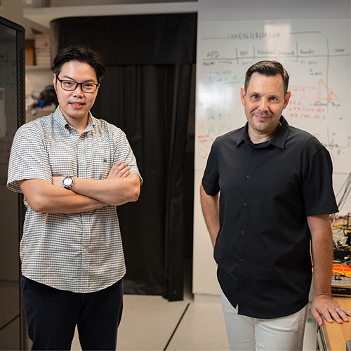 Two researchers leading the National Quantum-Safe Network in Singapore pictured in laboratory at the Centre for Quantum Technologies